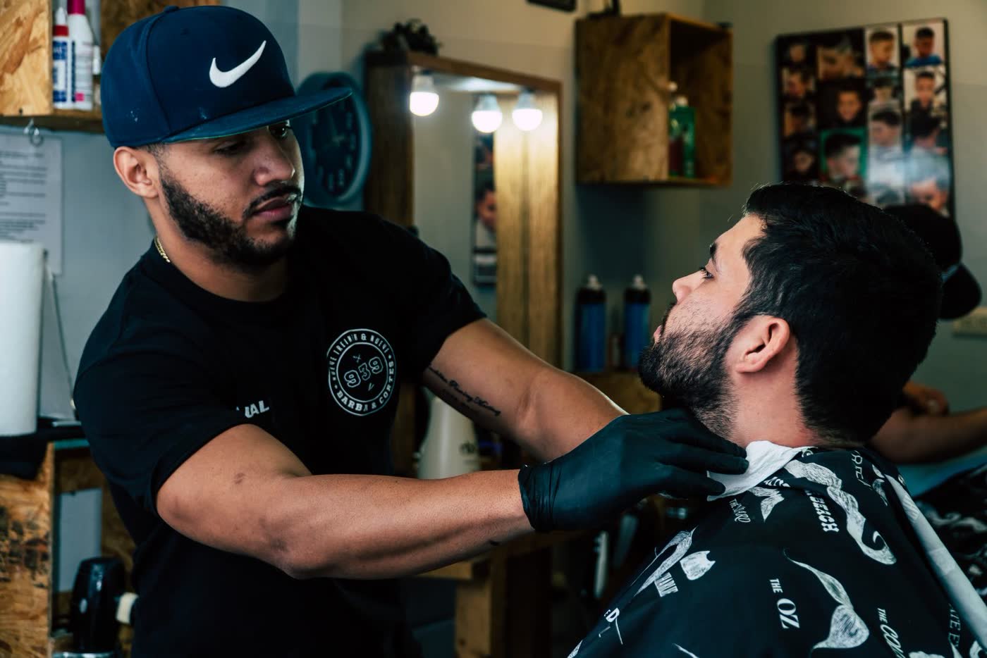 Barber shaving the back of a client's neck