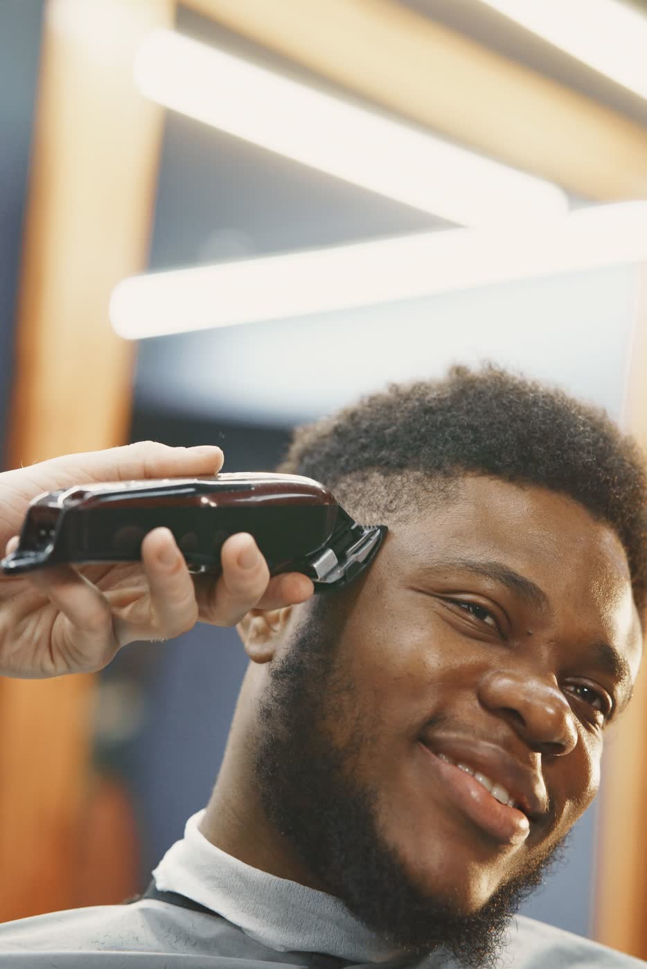 Smiling client after a fresh fade haircut